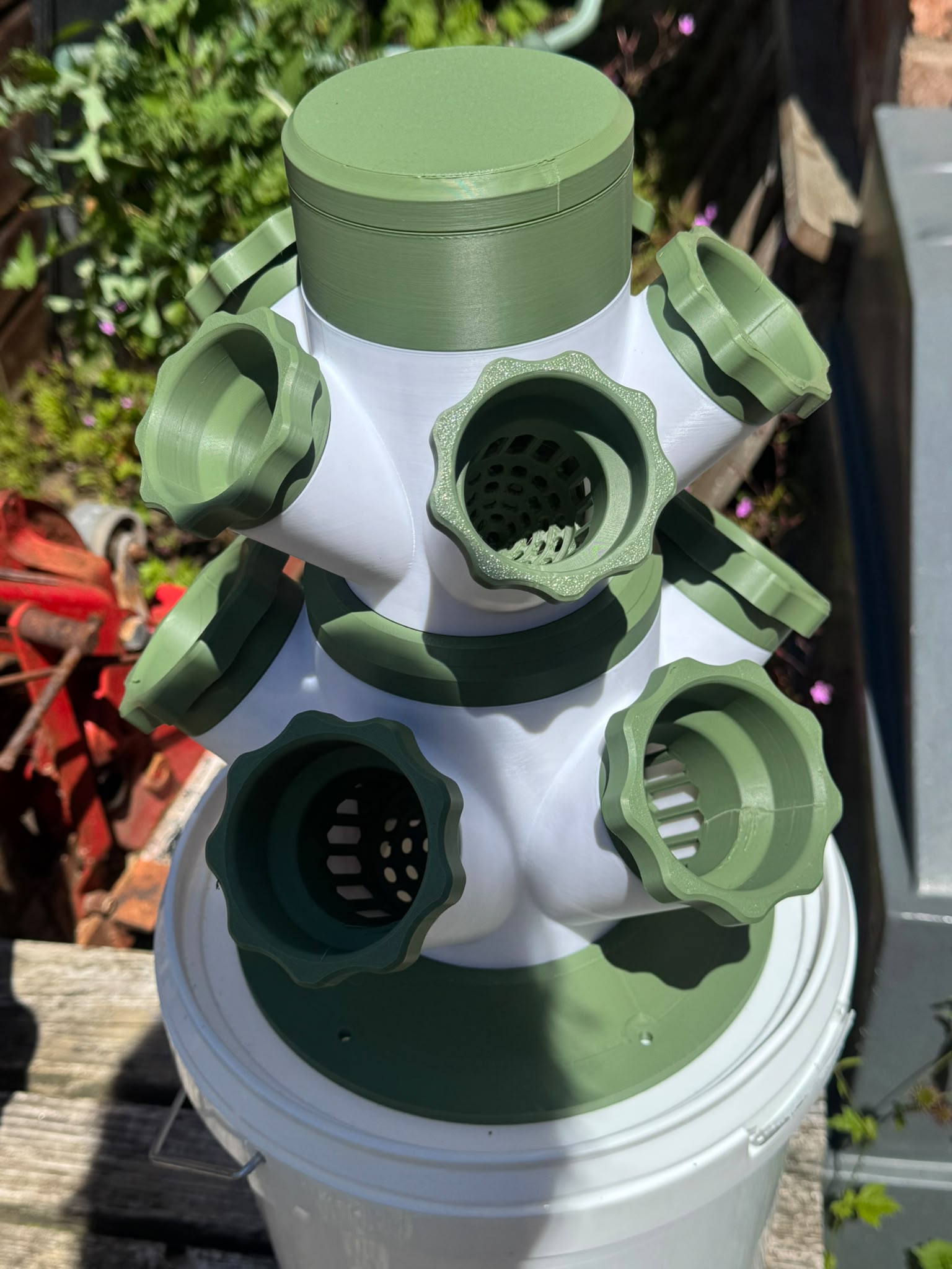 Close-up real product photo of HERB planting cups and tower sections