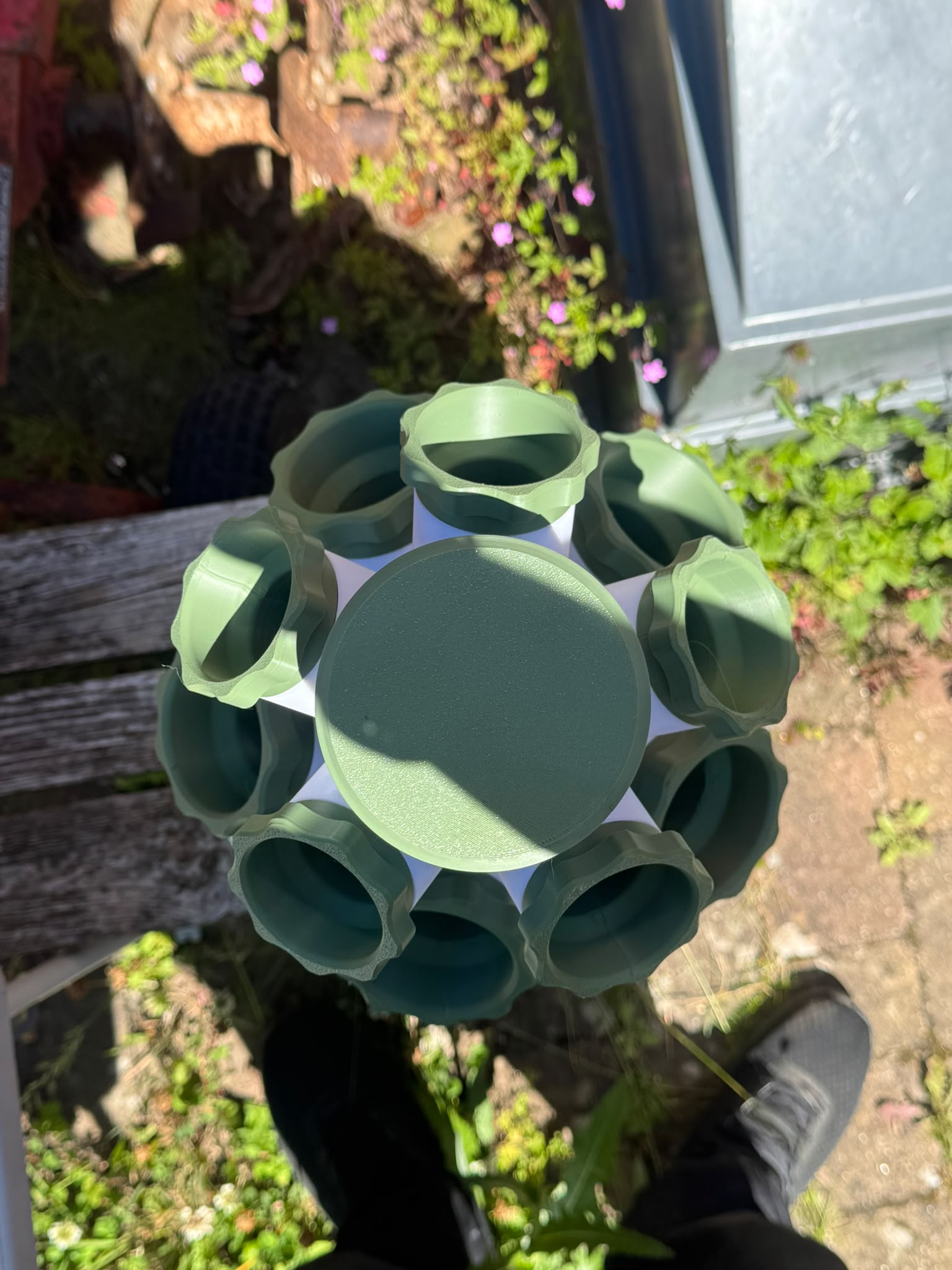 Top-down real product photo of the HERB modular hydroponic tower